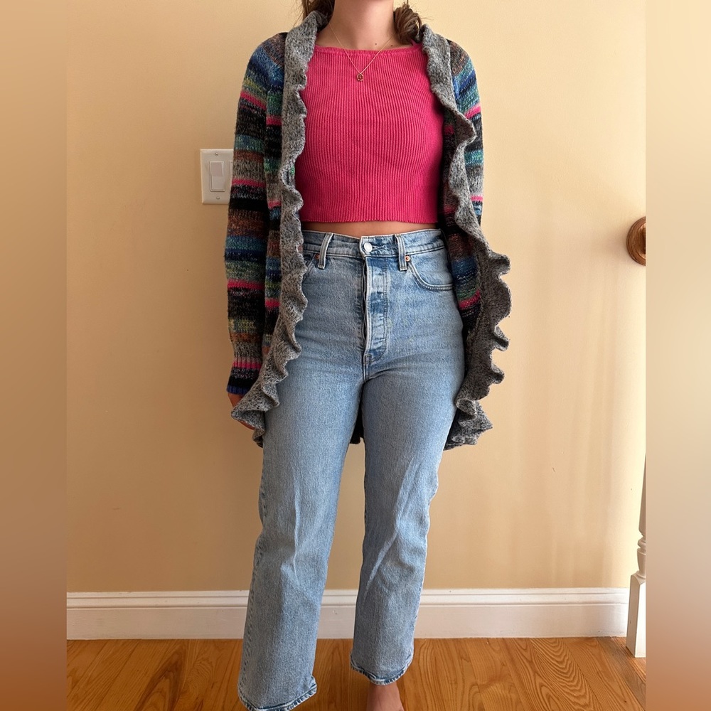 Multicolored crochet cardigan with ruffled lining and pockets, includes belt